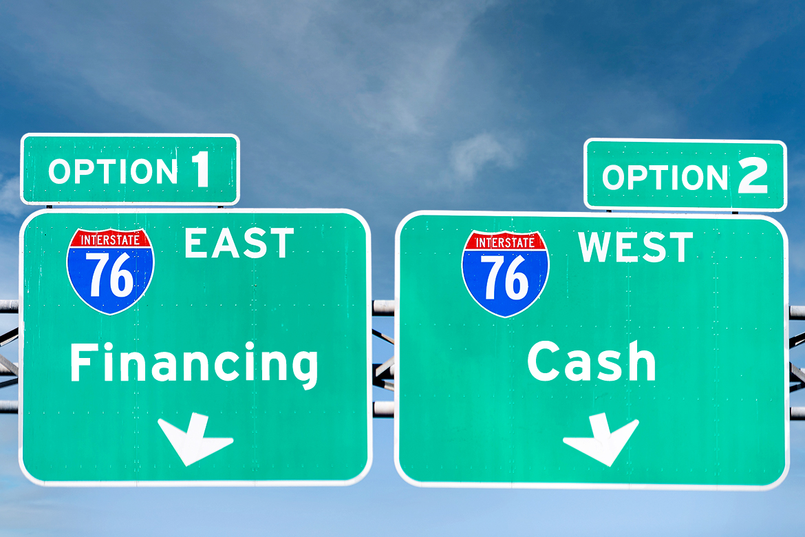 A highways sign showing two diverging directions labeled Financing and Cash 
